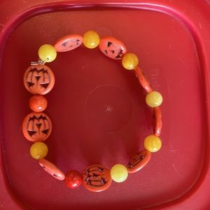 Orange Jack o lantern beaded bracelet.